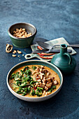 Indian green cabbage curry with crispy tofu and peanuts