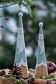 Father Christmas cones, Advent decoration on a pile of wood, close-up