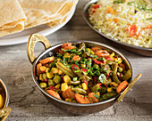 Indian vegetable curry with rice and papadam