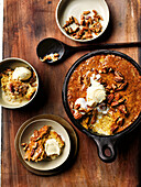 Spicy South African pudding with pecans and ice cream