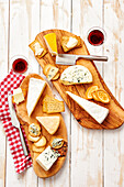 Cheese platter with French cheeses, crackers and red wine