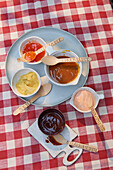 Barbecue sauces with labelled disposable spoons
