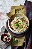 Hearty spelt porridge with avocado and sprouts