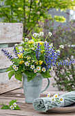 Bouquet of edible flowers, daisies, strawberries, garlic rocket, yellow deadnettle, ground ivy