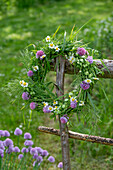 Wreath of grasses with chamomile, chives, shepherd's purse