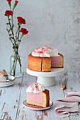 Strawberry mousse cake with whipped cream decorated with strawberry powder