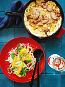 Cheese and potato gratin with baby leaf salad with fennel and orange