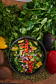 Tabouleh salad with avocado, peppers and onions