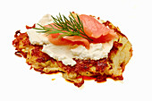 Potato pancake with salmon isolated on white background