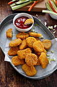 Crispy chicken nuggets with ketchup