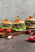 Burger with lettuce, tomatoes and radishes