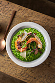 Pea risotto with prawns and parmesan emulsion
