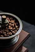 Coffee beans in an antique coffee grinder