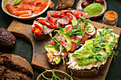 Wholemeal sourdough bread with avocado, cold cuts and vegetables