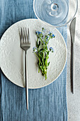 Spring table decoration with forget-me-not flowers