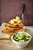 Chicken escalope with potato and cucumber salad