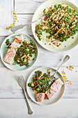 Almond milk salmon with spinach tabouleh and hummus dressing