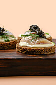 Bread with herring, horseradish cream and caviar