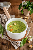 Soup with wild garlic in a pot