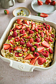 Strawberry and raspberry tiramisu with pistachios