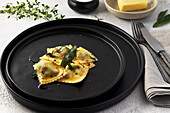 Ravioli with spinach and ricotta filling and sage butter