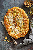 Potato galette with parmesan and pine nuts