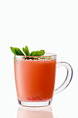 Hot strawberry winter drink with anise and mint