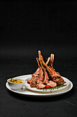 Grilled rack of lamb with herbs and spicy sauce