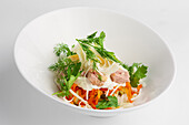 Colourful tuna salad with egg, carrot, onions and mayonnaise