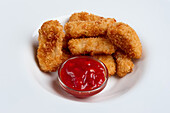 Deep-fried chicken nuggets with tomato ketchup