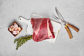 Raw beef roll roast with garlic and thyme