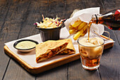 Flatbread with beef filling, chips and cola