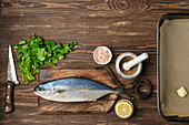 Fresh yellowtail mackerel with lemon, parsley and spices