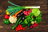 Still life of fresh vegetables on a wooden surface
