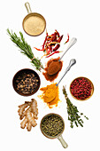 Various spices and herbs on a white background