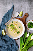 Asparagus soup with coconut milk, lime and cress