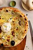 Pizza with mushrooms, burrata and truffle oil