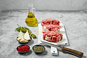 Raw lamb loin steaks with thyme and spices