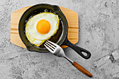 Fried egg in a small pan