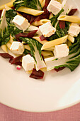 Pasta salad with feta cheese, beetroot and chard