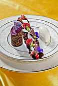 Chocolate cannelloni with figs, cassis ice cream, hazelnut ice cream and brownie
