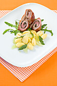 Saltimbocca rolls with gnocchi and rocket