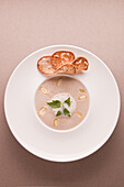 Chestnut velvet soup with celery cubes and croutons