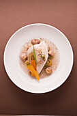 Poached chicken breast with vegetables and chestnuts