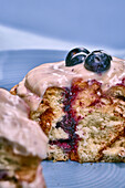 Cinnamon buns with blueberries and icing