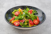 Salad with orange, chilli, tomato, cucumber and avocado
