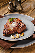 Grilled beef steak with butter and garlic