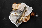 Whole dried sea bream and sea bass with beer