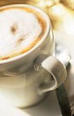 Cappuccino with milk foam, close-up