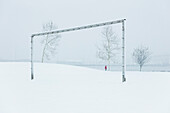 Soccer goal posts on snowy day
